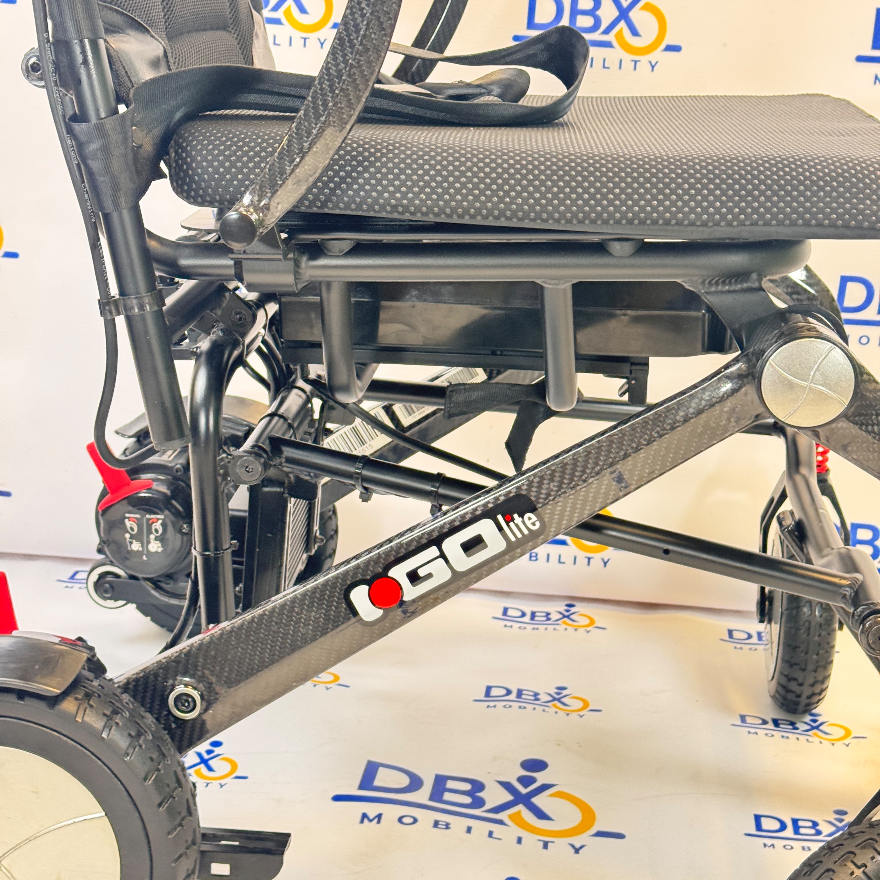 Pride iGo Lite Carbon Refurbished Folding Powerchair | DBX Mobility