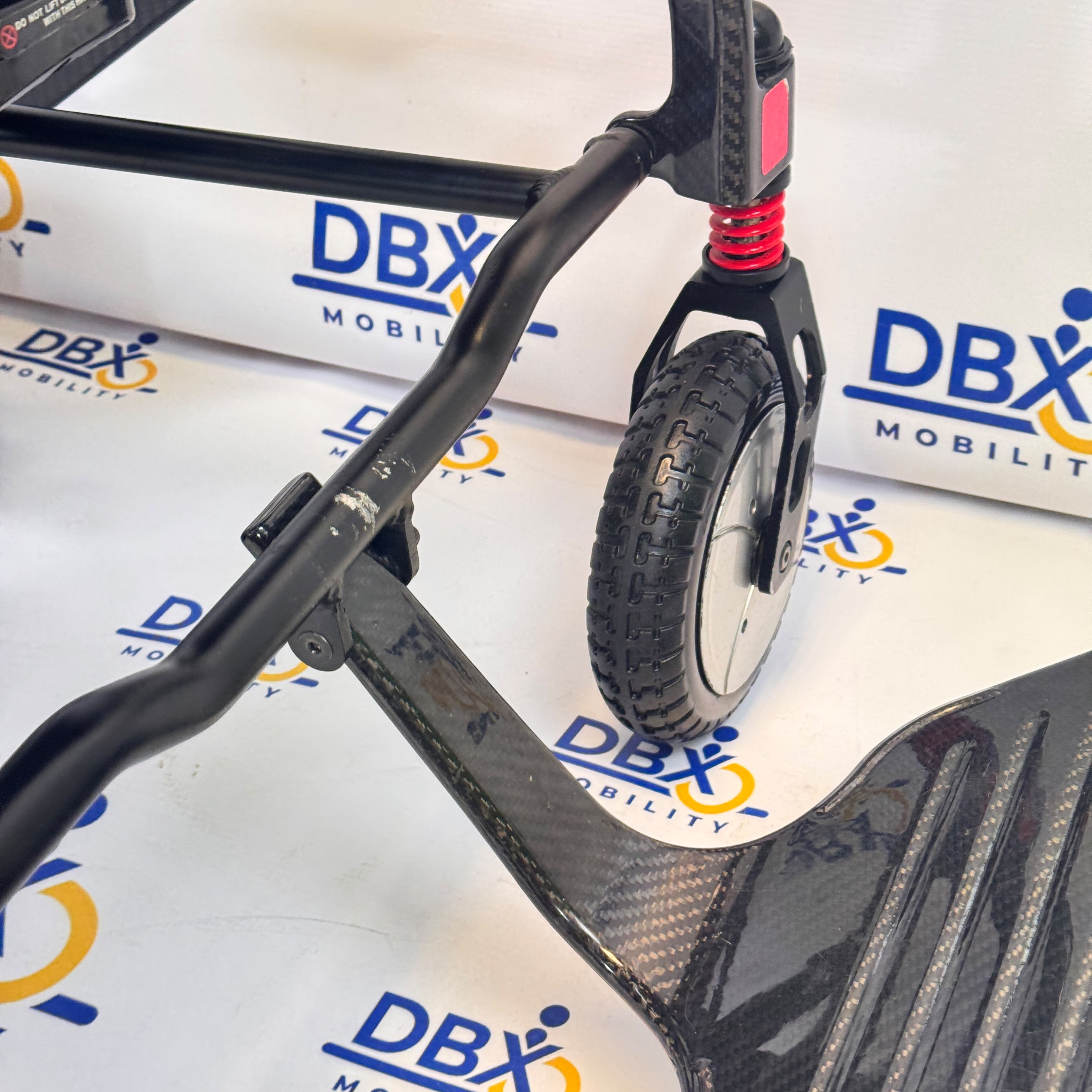 Pride iGo Lite Carbon Refurbished Folding Powerchair | DBX Mobility