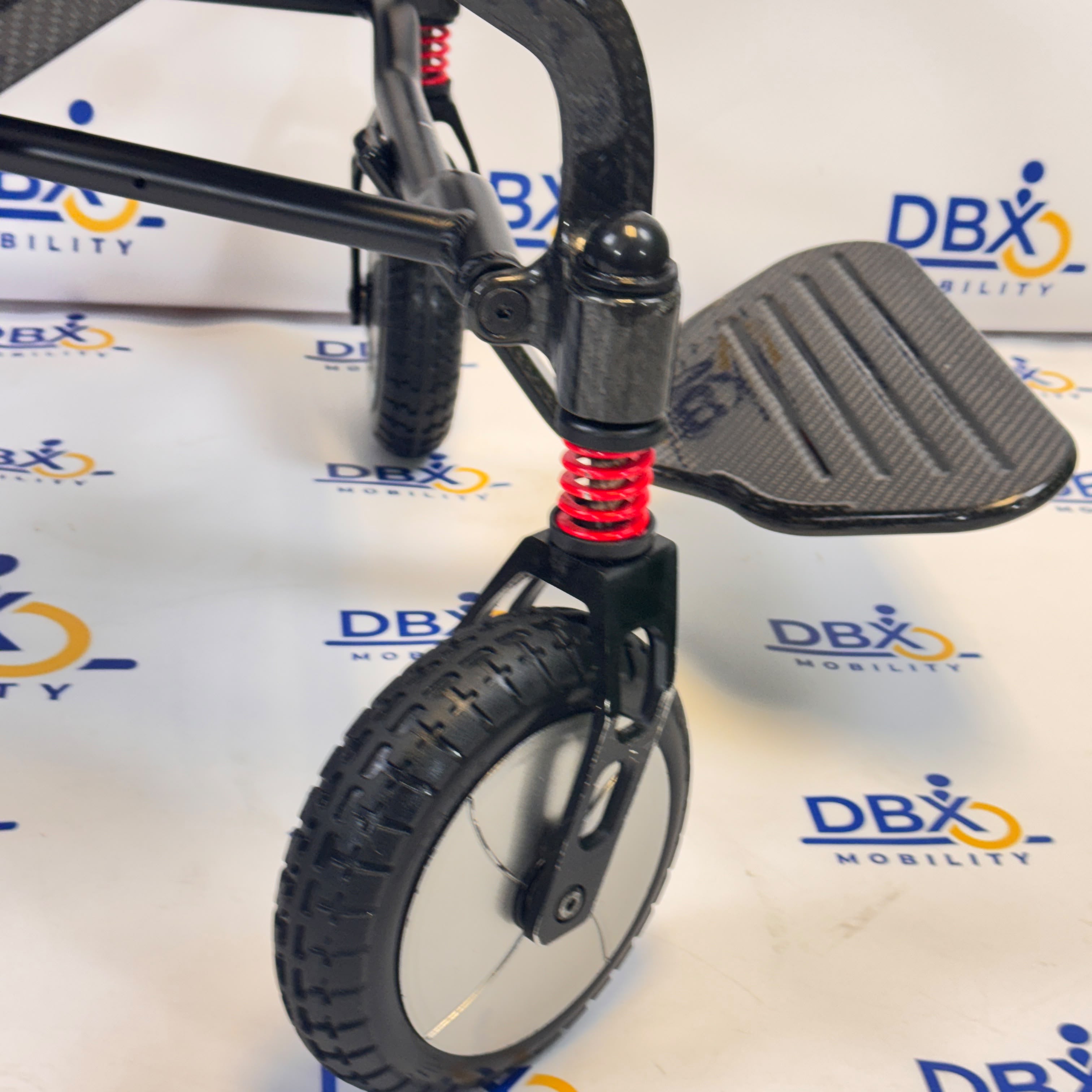 Pride iGo Lite Carbon Refurbished Folding Powerchair | DBX Mobility