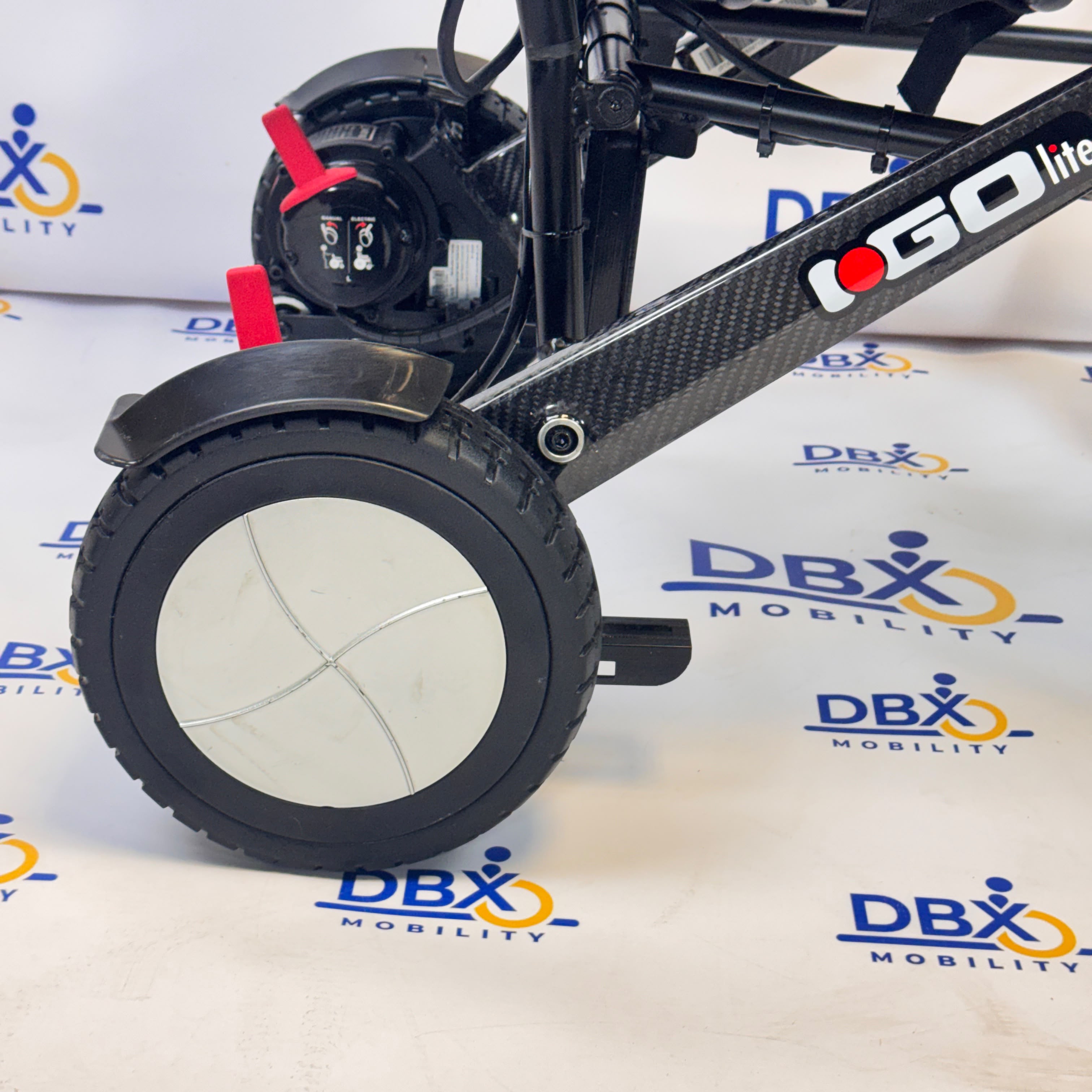 Pride iGo Lite Carbon Refurbished Folding Powerchair | DBX Mobility
