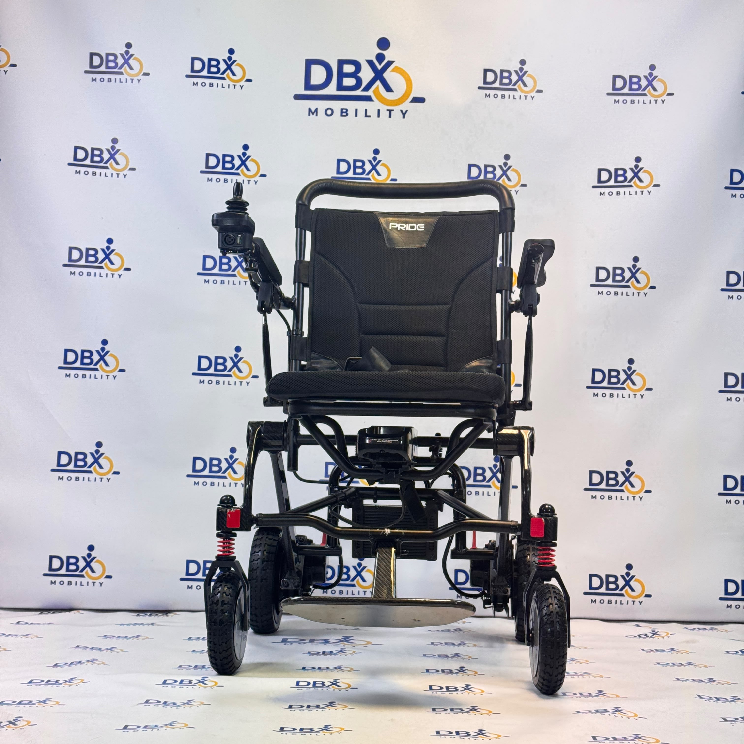 Pride iGo Lite Carbon Refurbished Folding Powerchair | DBX Mobility
